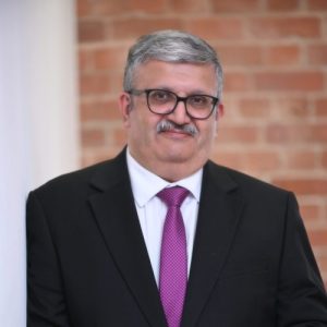 Picture of Jabeer Butt looking at camera.