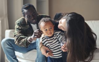 Young multi-race family on the sofa