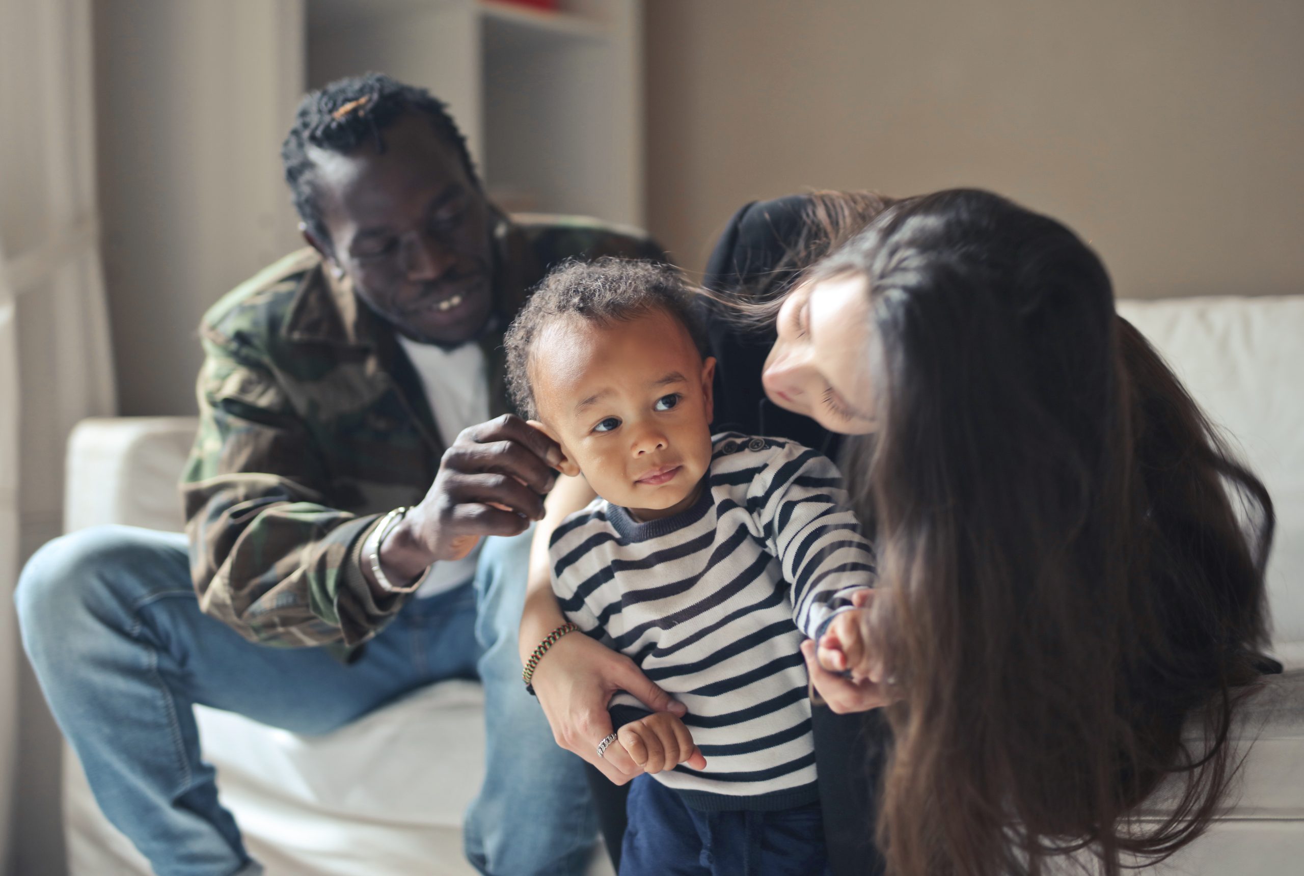 Young multi-race family on the sofa